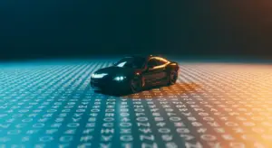 saas-cfo-hero-1 - SaasCEO.com - SaasCEO.com Black sports car model on a surface covered with rows of white characters, lit with blue-to-orange gradient light.