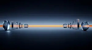 Abstract glass spheres and prisms aligned along a glowing orange line, suggesting fiber optic data transmission in a dark studio setting.